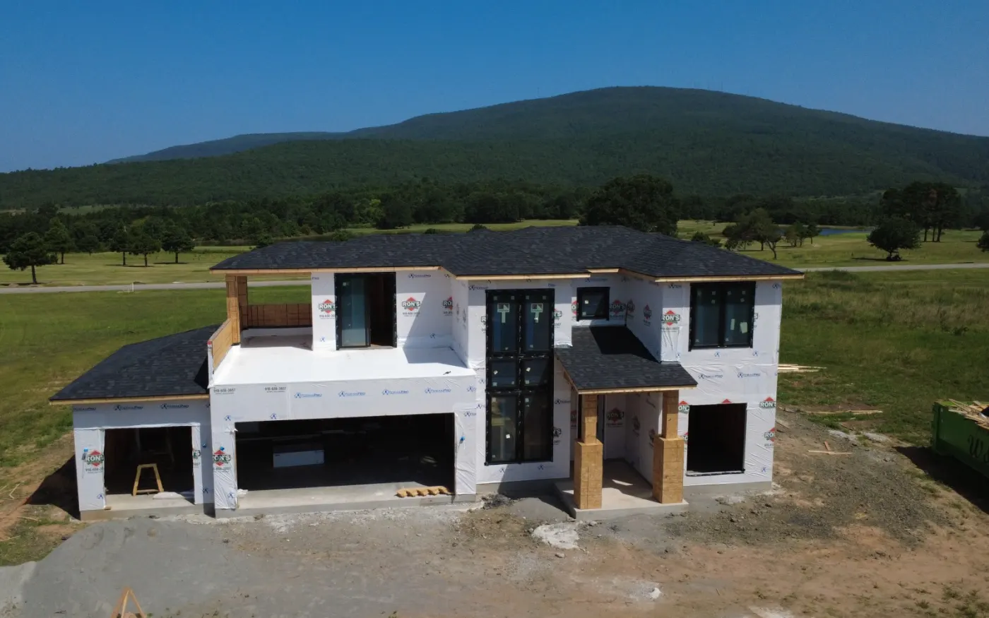 The same new build with its finished architectural shingle roof installed