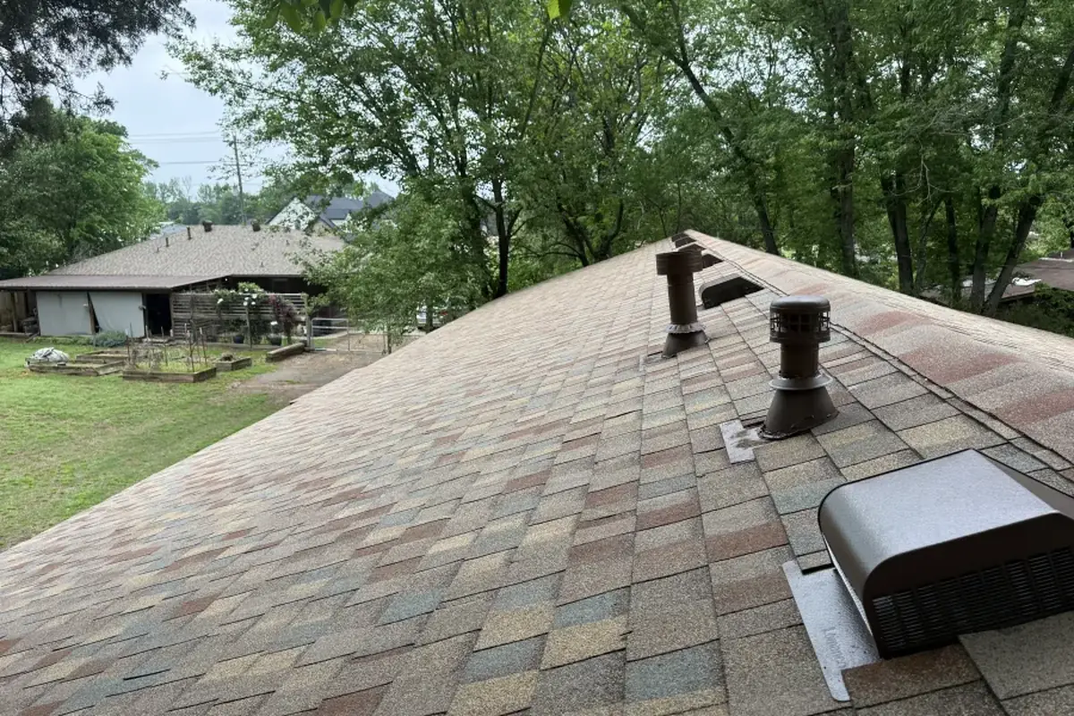 TAMKO Titan XT shingles in Painted Desert with a turbine vent, pipe boot and box vent