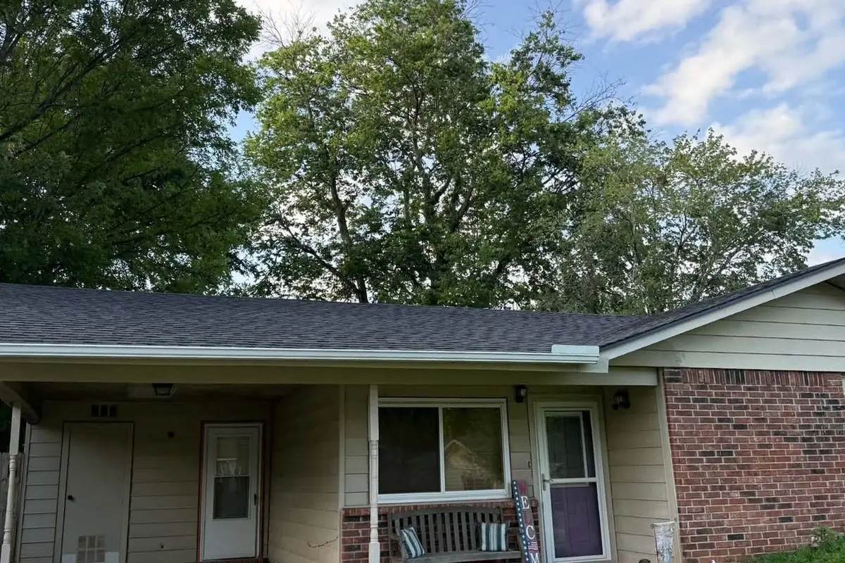 The same ranch house with its new dark TAMKO Titan XT shingle roof