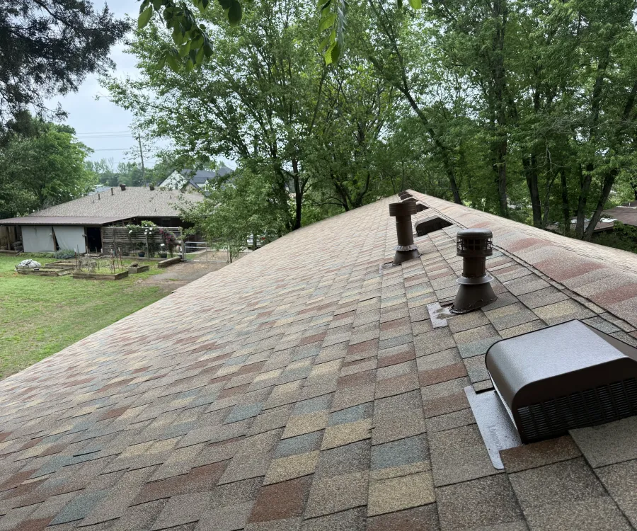 TAMKO Titan XT architectural shingles in the Painted Desert color blend, with a new color-matched turbine vent, pipe boot and box vent